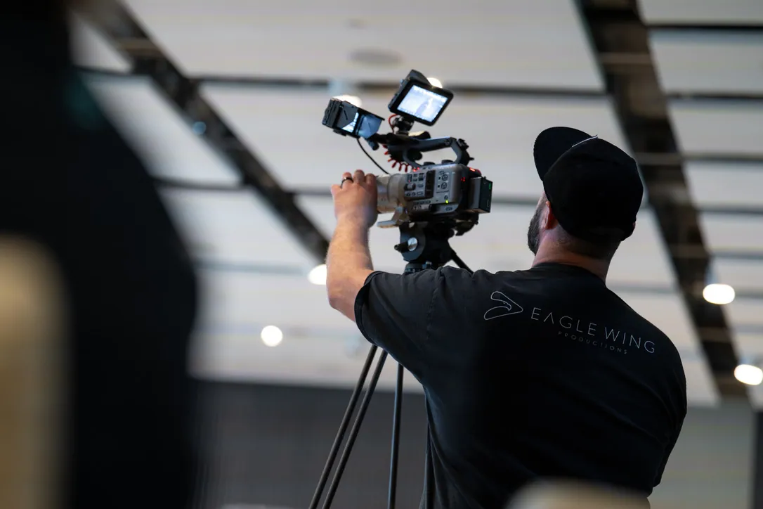Andrew Eckhoff filming with a cinema camera on a Salt Lake City video production